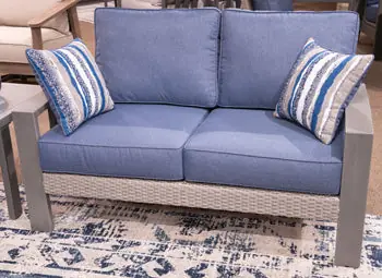 Half Moon Beach Outdoor Loveseat with Cushion - Ashley Furniture